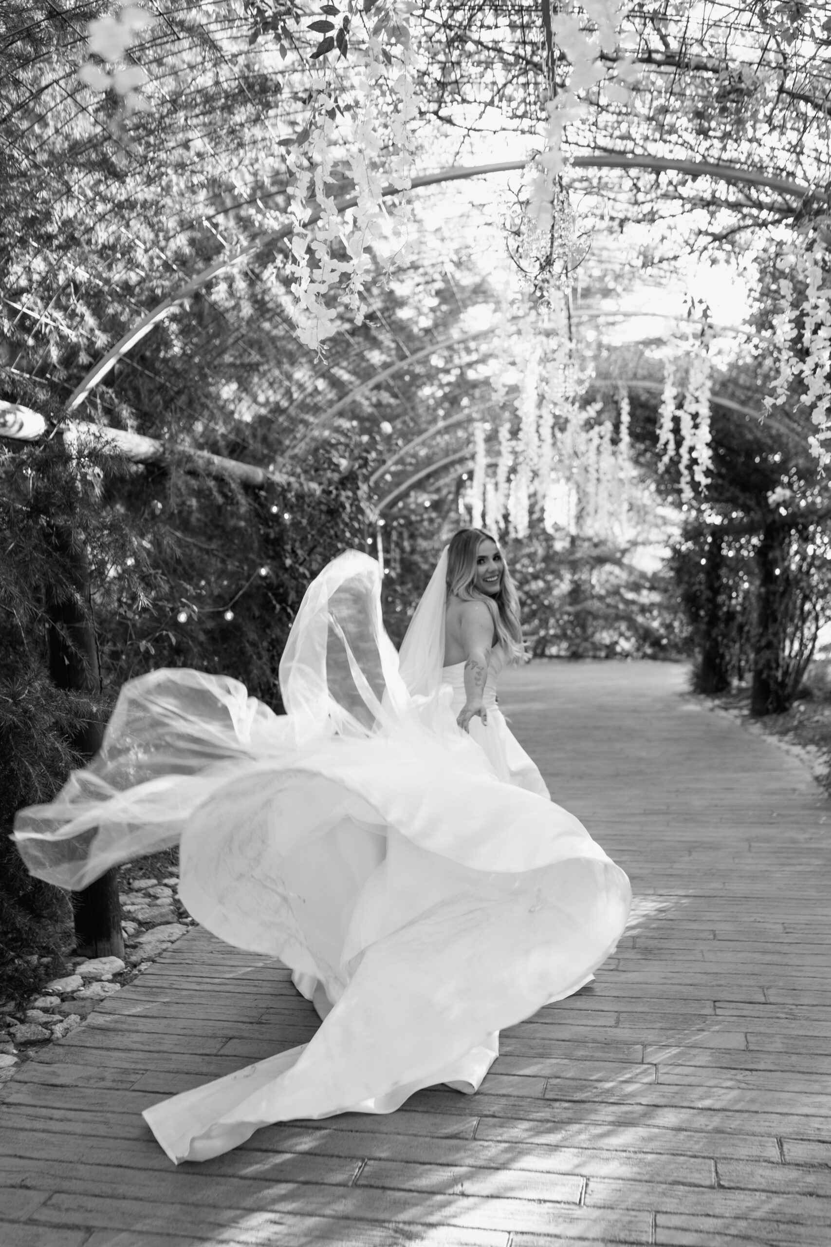 Bride running in dress at Serendipity Gardens in Southern California